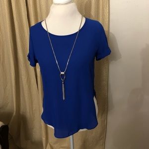 Blue top with cuffed sleeves